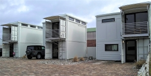 a picture containing building, outdoor sky, container housing